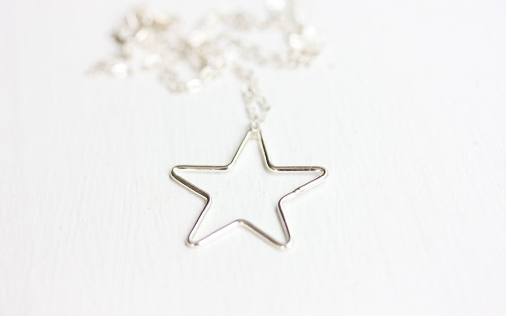 Simple sterling silver star necklace from Diament Jewelry, a gift shop in Washington, DC.