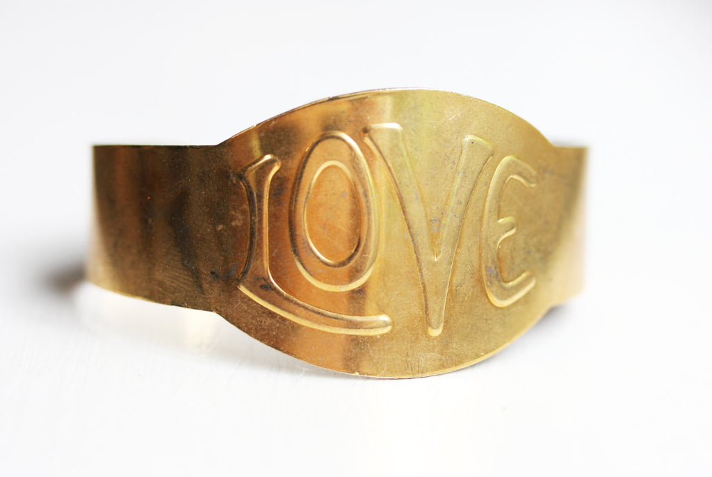 Gold Love Cuff from Diament Jewelry, a gift shop in Washington, DC.