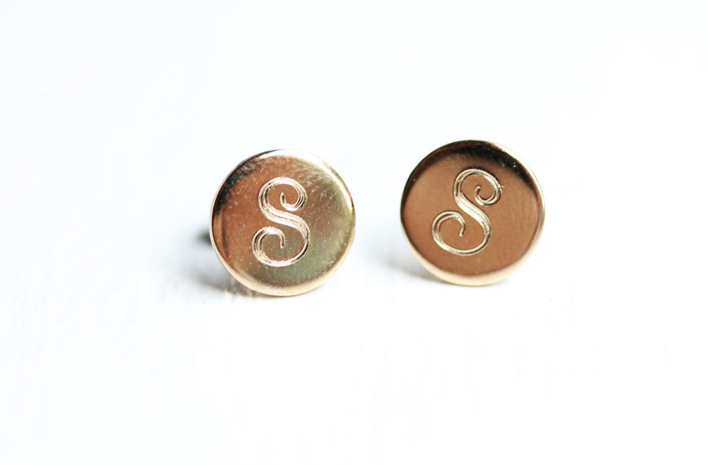 Initial gold dot studs from Diament Jewelry, a gift shop in Washington, DC.