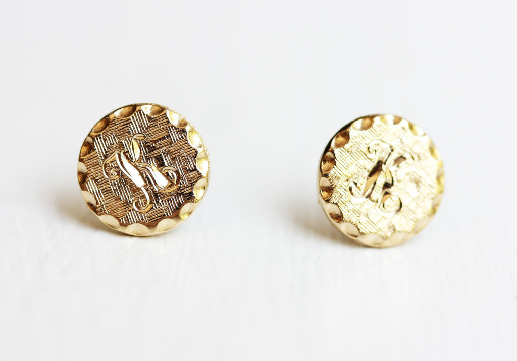 Textured K initial gold dot studs from Diament Jewelry, a gift shop in Washington, DC.