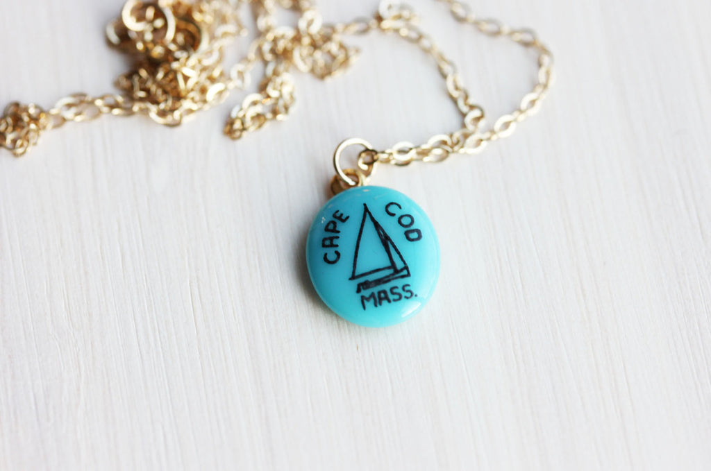 Tiny Gold Cape Cod Necklace from Diament Jewelry, a gift shop in Washington, DC.