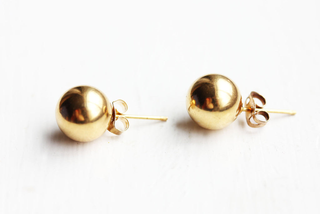 Classic gold ball studs from Diament Jewelry, a gift shop in Washington, DC.