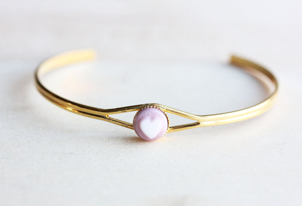 Pink heart dot gold cuff bracelet from Diament Jewelry, a gift shop in Washington, DC.