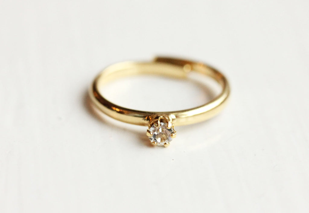 Tiny crystal dot gold ring from Diament Jewelry, a gift shop in Washington, DC.