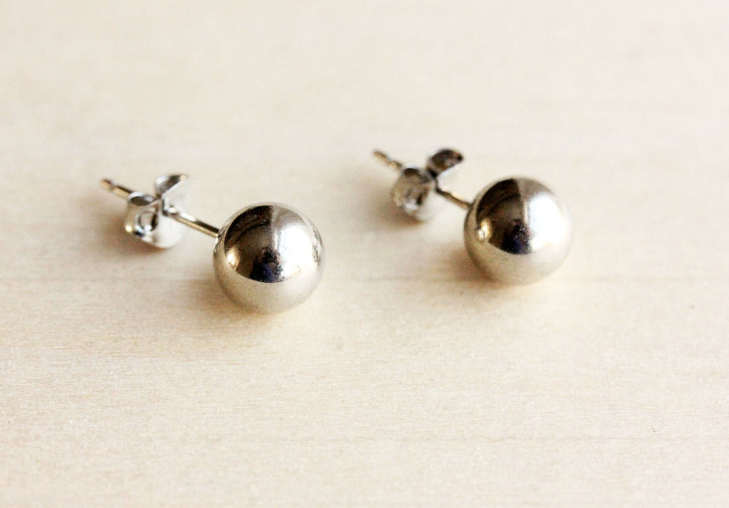 Silver ball studs from Diament Jewelry, a gift shop in Washington, DC.
