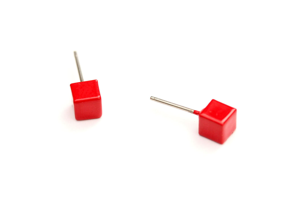Red cube studs from Diament Jewelry, a gift shop in Washington, DC.