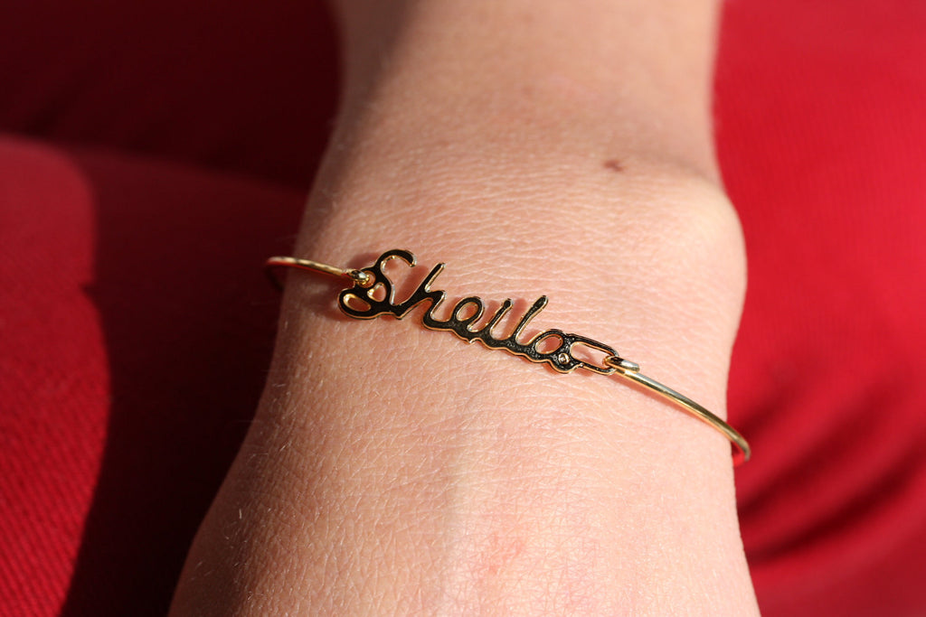 Vintage Sheila gold name bracelet from Diament Jewelry, a gift shop in Washington, DC.