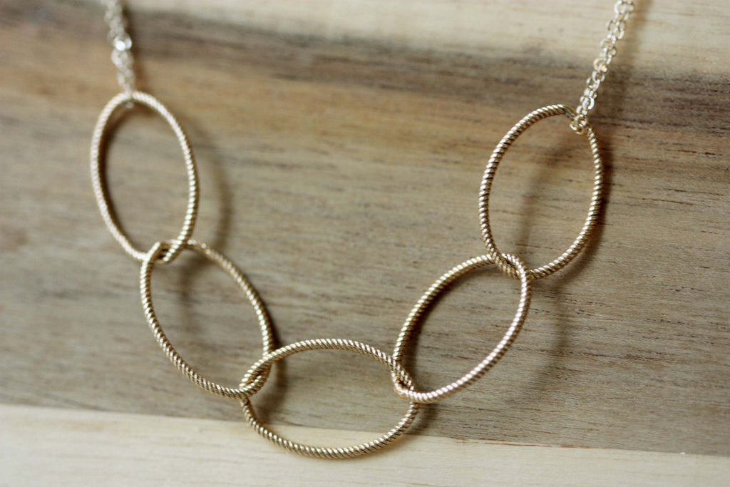 Gold oval necklace from Diament Jewelry, a gift shop in Washington, DC.