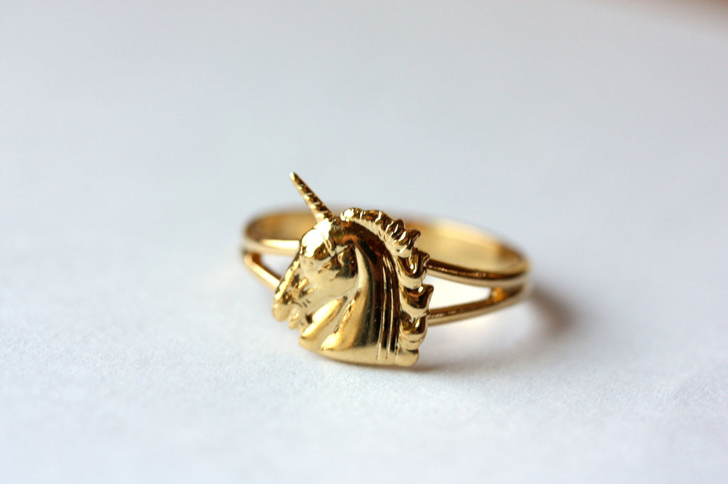 Vintage small gold unicorn ring from Diament Jewelry, a gift shop in Washington, DC.