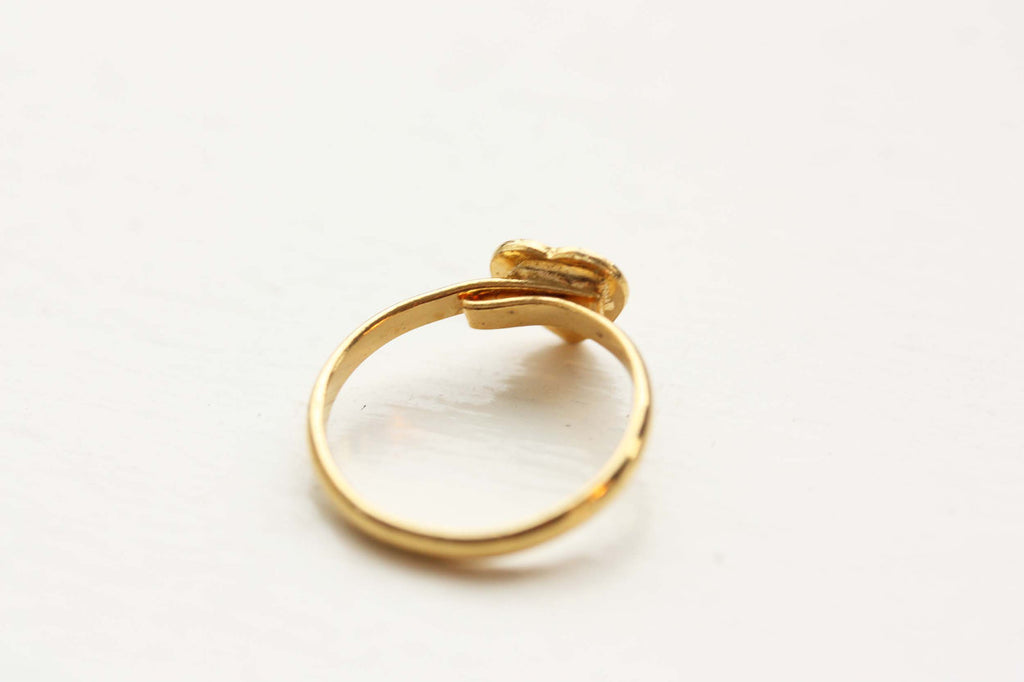 Vintage adjustable gold initial ring from Diament Jewelry, a gift shop in Washington, DC.